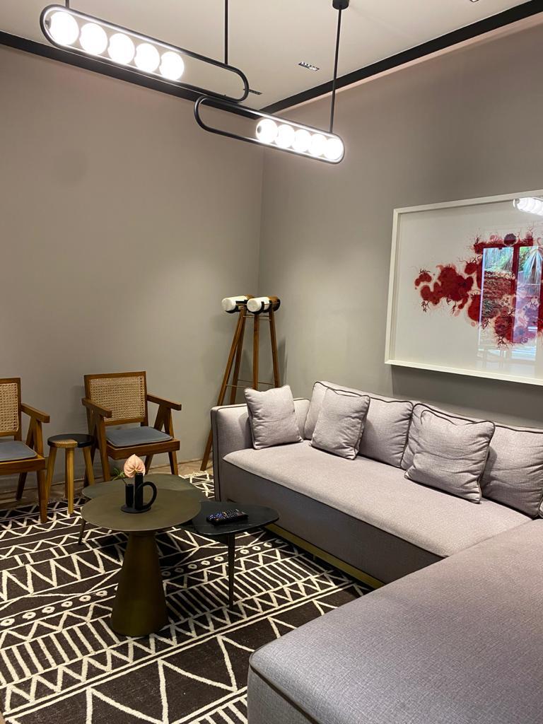 Neutral-toned living room with art piece