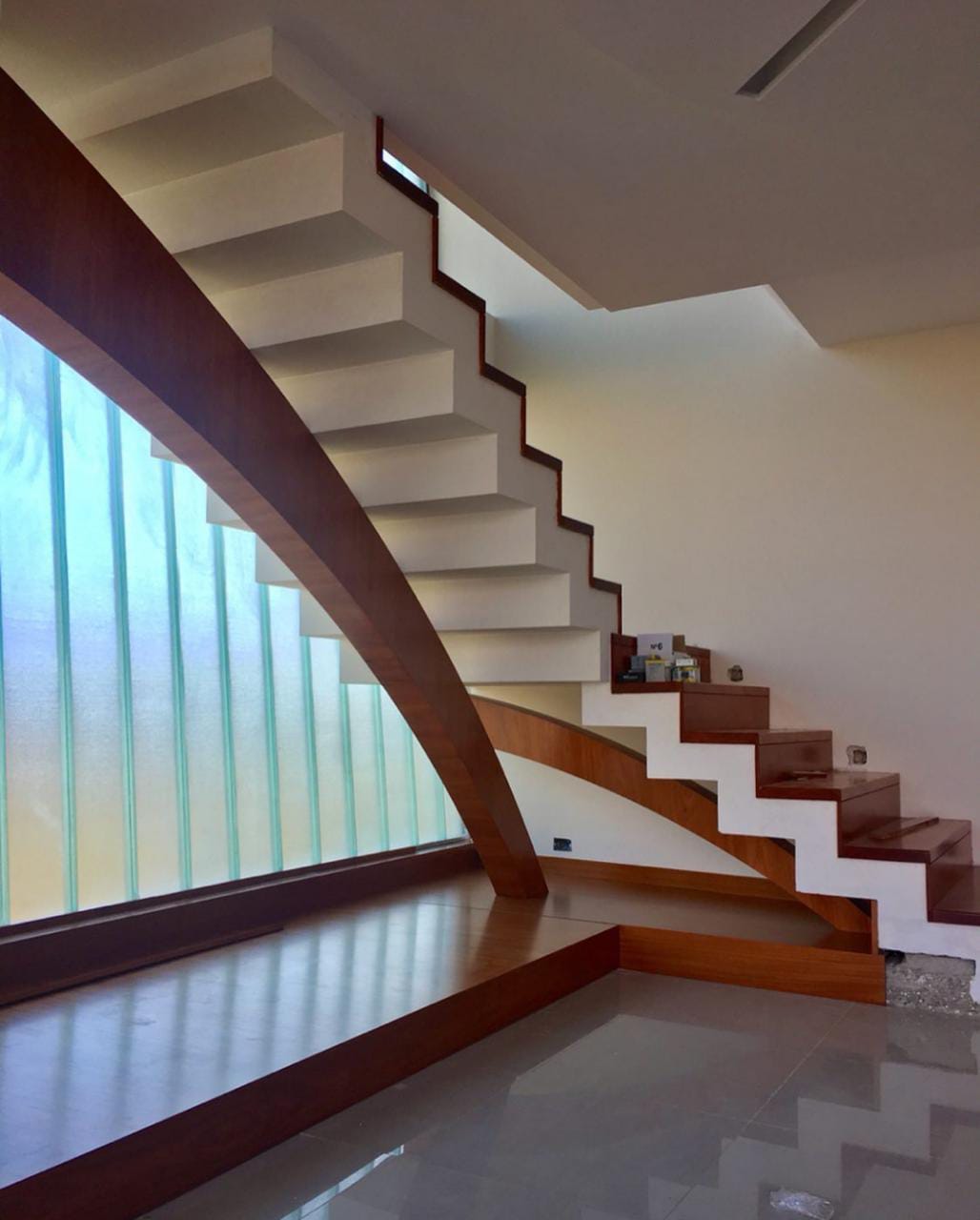 Spiral staircase with curved wooden railing